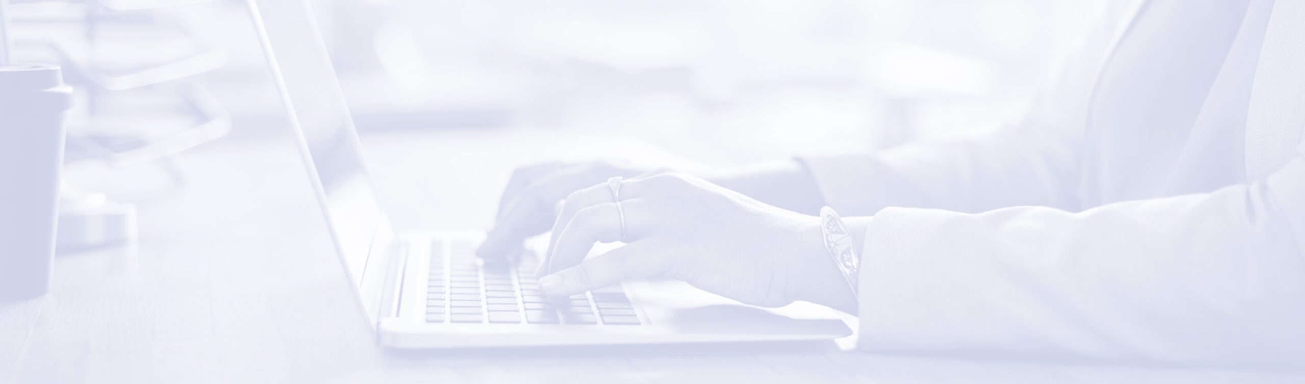 close-up of woman typing on laptop with overlay